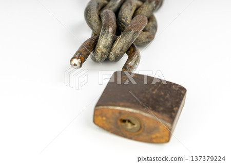 Old unlocked padlock and rusty chain isolated on white background Old unlocked padlock and rusty chain isolated on white background 137379224