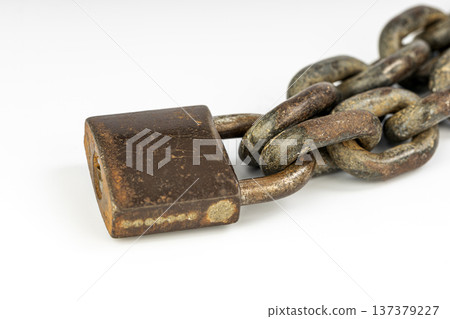 Rusty locked padlock and chain isolated on white background 137379227