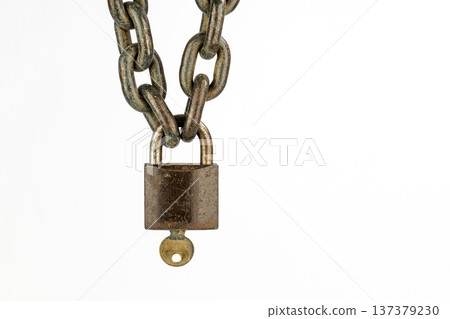 Rusty locked padlock with key with copy space isolated on white background 137379230