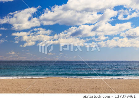 An empty beach and a clear sky with white clouds An empty beach and a clear sky with white clouds 137379461