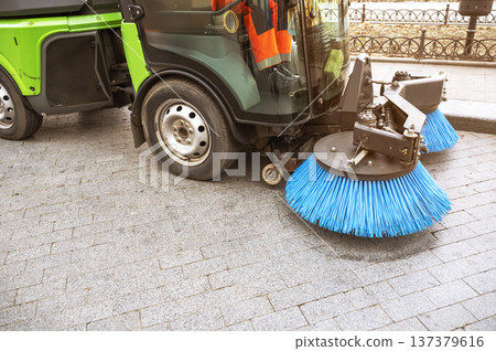 Green municipal cleaning vehicle for sweeping and washing urban sidewalks 137379616