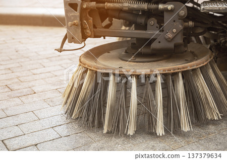 Close up of a blue mechanical brush on a professional street cleaning machine Close up of a blue mechanical brush on a professional street cleaning machine 137379634