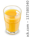 Freshly squeezed cold orange juice in a misty glass isolated on a white 137380340