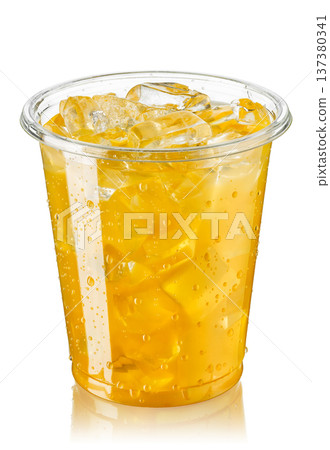 Disposable plastic glass of cold orange juice with ice isolated on white 137380341