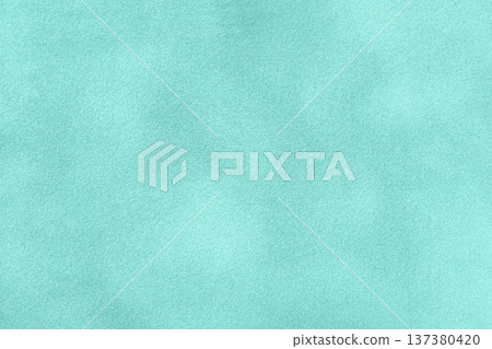 Light turquoise suede fabric background with matte nap velvet texture. Mint tones and soft felt textile surface in macro 137380420
