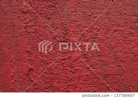 Wall of concrete piles is painted with red paint. Wall of concrete piles is painted with red paint. 137380607
