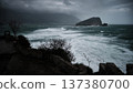 Stormy Sea with Waves Crashing Toward Rocky Island 137380700