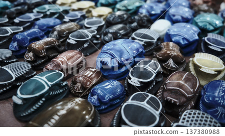 Colorful Scarab Beetle Souvenir Figurines at Market Stall 137380988