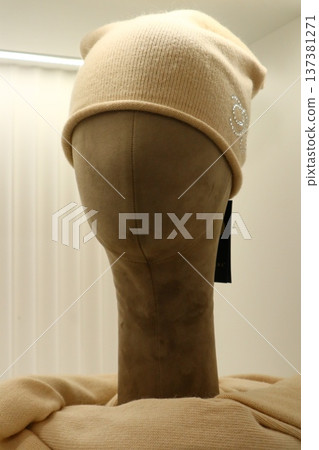 Close-up of a sleek mannequin head in a retail store. 137381271