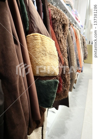 Clothes store in shopping mall. 137381286