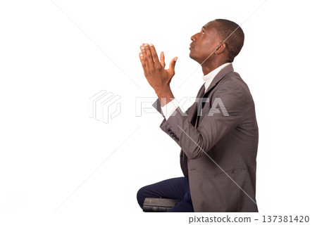 portrait of young man praying. 137381420