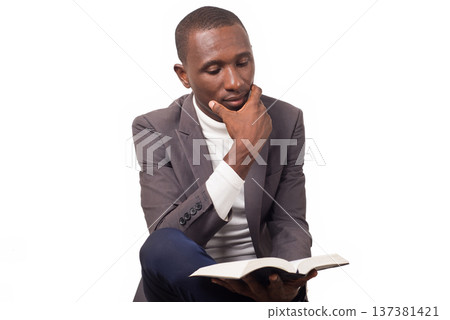 portrait of young man with a Bible in his hand. 137381421