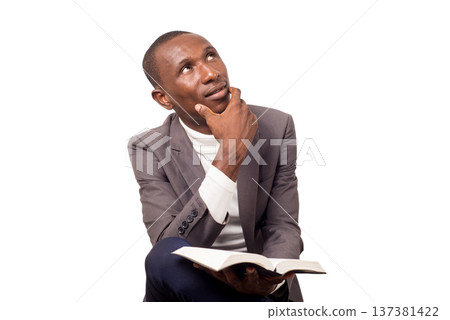 portrait of young man with a Bible in his hand. portrait of young man with a Bible in his hand. 137381422