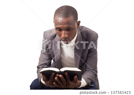 portrait of young man with a Bible in his hand. 137381423