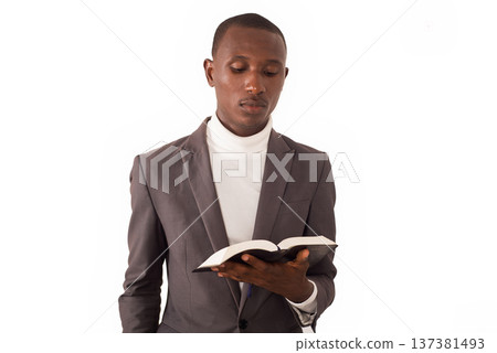 portrait of young man with book in hand 137381493