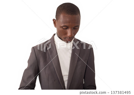 portrait of young man in a suit standing. 137381495