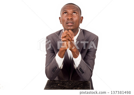portrait of young man praying. 137381498