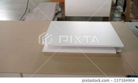 White furniture parts ready for assembly in a factory workshop White furniture parts ready for assembly in a factory workshop 137384904