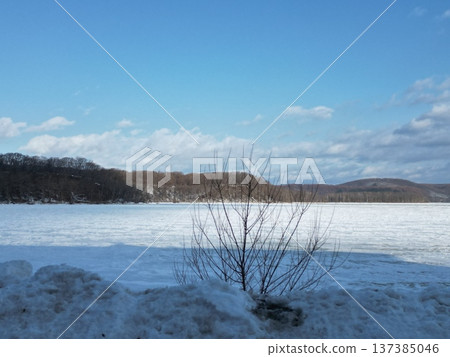 Aerial view of the winter scenery from the shore of Lake Abashiri, which is completely frozen over Aerial view of the winter scenery from the shore of Lake Abashiri, which is completely frozen over 137385046