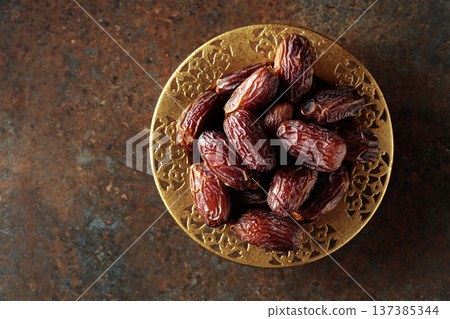 Dates on a golden platter. Dates on a golden platter. 137385344