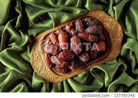 Dates on a golden platter. Dates on a golden platter. 137385348