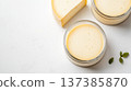 Artisanal cheese with herb garnish on white background for gourmet, organic, farm-to-table concepts 137385870