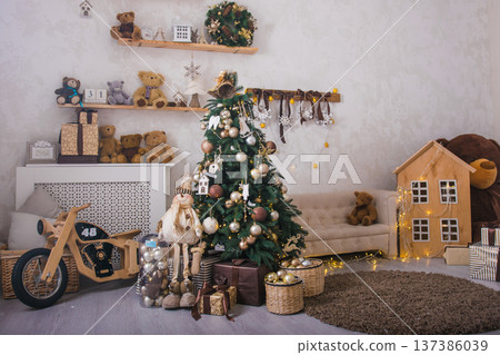 Christmas and New Year concept. Christmas tree with toys in the interior Christmas and New Year concept. Christmas tree with toys in the interior 137386039