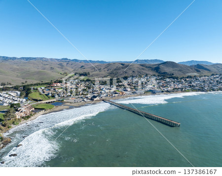Aerial view of Cayucos, California USA, Pier, Ocean Ave and Shoreline Beach with Green Hills in San Luis Obispo County 137386167