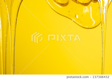 Abstract yellow background with viscous honey texture. Abstract yellow background with viscous honey texture. 137386432
