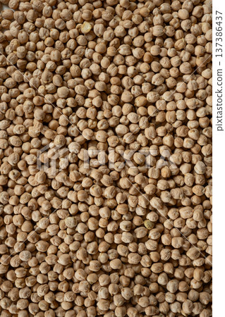 Raw uncooked chickpeas background top view. Raw uncooked chickpeas background top view. 137386437