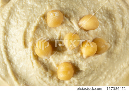 Macro texture of smooth creamy hummus top view Macro texture of smooth creamy hummus top view 137386451