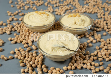 Vegan appetizer hummus garnished with boiled chickpeas. Vegan appetizer hummus garnished with boiled chickpeas. 137386454