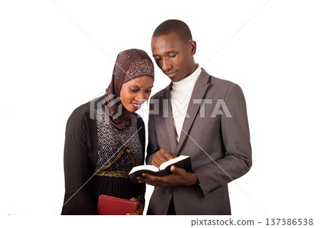 portrait of two religious standing with religious documents. 137386538