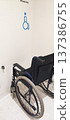 A wheelchair in a designated area for people with disabilities inside the building. The concept of inclusive infrastructure and support for people with disabilities. 137386755