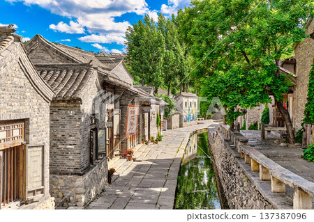 The ancient water town of Gubei near the site of the Great Wall of Simatai on a clear summer day. 137387096