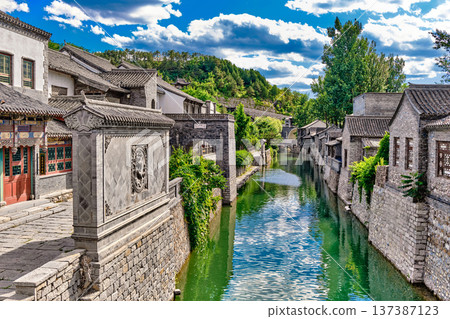 The ancient water town of Gubei near the site of the Great Wall of Simatai on a clear summer day. The ancient water town of Gubei near the site of the Great Wall of Simatai on a clear summer day. 137387123