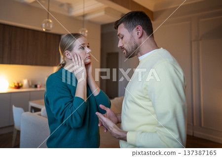 Lying husband confessing wife about love affair, toxic relationships and mistrust in marriage. Lying husband confessing wife about love affair, toxic relationships and mistrust in marriage. 137387165