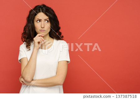 Portrait of doubtful young female pensive think with folded arms 137387518