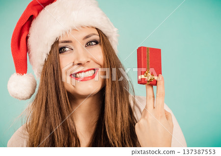 Woman holds gift box. Christmas time Woman holds gift box. Christmas time 137387553