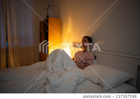 Tired thoughtful senior woman dealing with sleep disorder caused by mental problems and overthinking Tired thoughtful senior woman dealing with sleep disorder caused by mental problems and overthinking 137387598