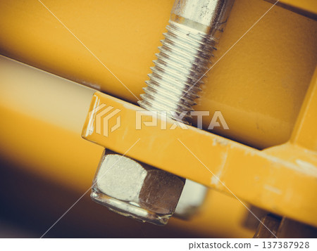 Screws on steel big machinery closeup 137387928