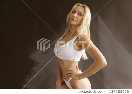 Beautiful blonde woman with smooth skin and toned body in white lingerie, beauty skin care and body care concep Beautiful blonde woman with smooth skin and toned body in white lingerie, beauty skin care and body care concep 137388956