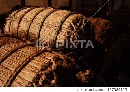Rice bales resting in the storehouse - an image of the joy of harvest and bountiful harvests Rice bales resting in the storehouse - an image of the joy of harvest and bountiful harvests 137389125