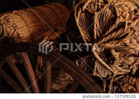Rice bales resting in the storehouse - an image of the joy of harvest and bountiful harvests Rice bales resting in the storehouse - an image of the joy of harvest and bountiful harvests 137389126