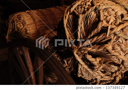Rice bales resting in the storehouse - an image of the joy of harvest and bountiful harvests Rice bales resting in the storehouse - an image of the joy of harvest and bountiful harvests 137389127