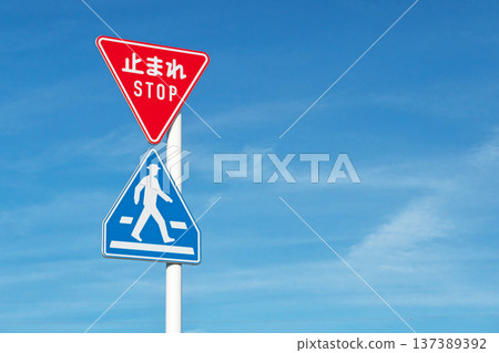 Road signs: "Crosswalk ahead" and "Stop" 137389392