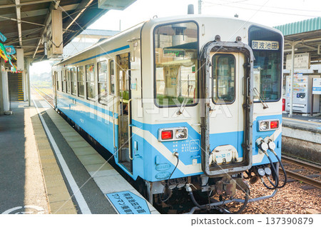 A local train and a quiet station A local train and a quiet station 137390879