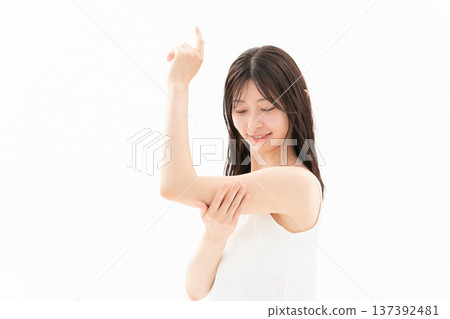 Beauty image of a woman doing skin care on a white background Beauty image of a woman doing skin care on a white background 137392481