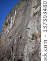 Climber climbing a rocky place 137393480