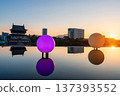 Kokura Castle with colorful light up bulb over pond at sunset, Kitakyushu 137393552